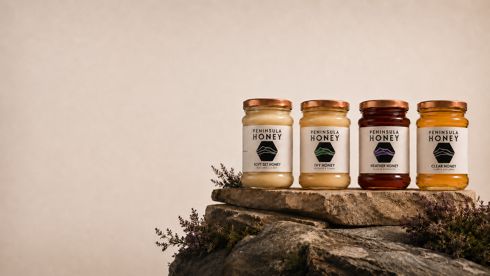 The four Peninsula Honey jars on a Cooley Mountain rock ledge